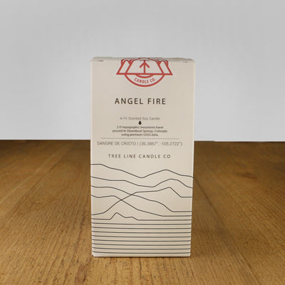 A white box with black lettering and a red and white Tree Line Candle Co.  logo.