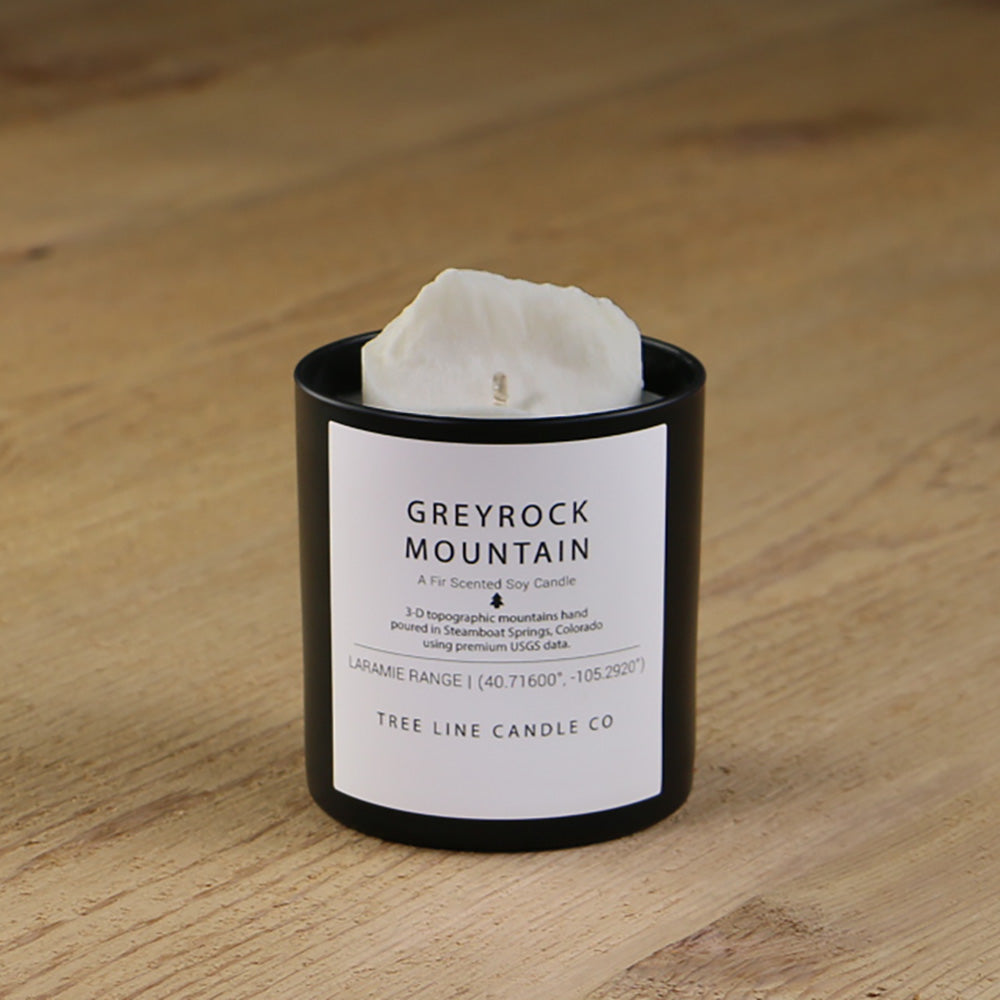  A white soy wax replica candle of Greyrock Mountain in a round, black glass.