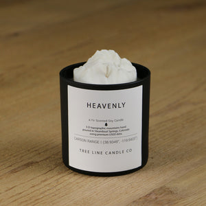  A white soy wax replica candle of Heavenly summit in a round, black glass.