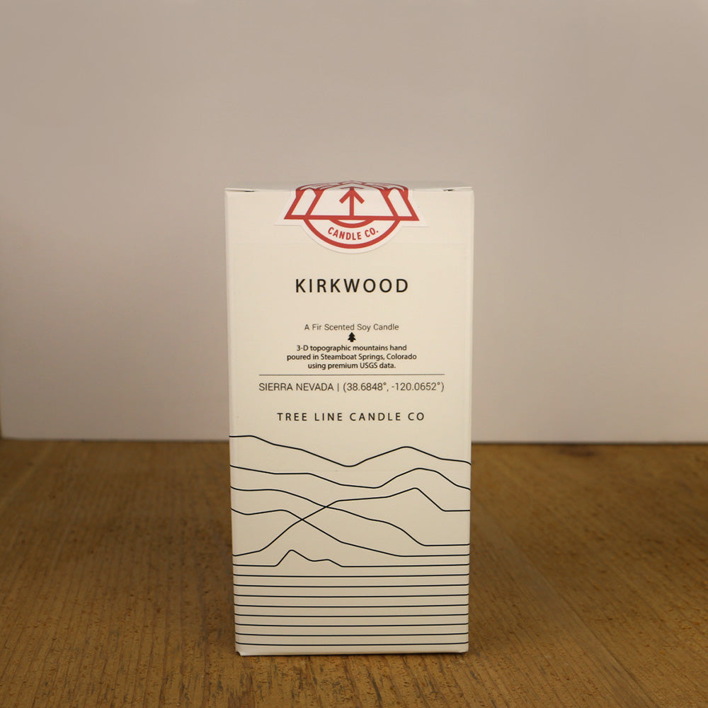 A white box with black lettering and a red and white Tree Line Candle Co.  logo.