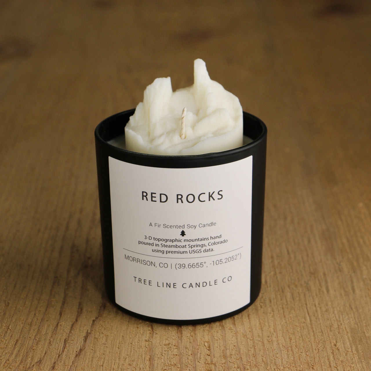  A white soy wax replica candle of Red Rocks area in a round, black glass.