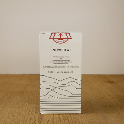 A white box with black lettering and a red and white Tree Line Candle Co.  logo.