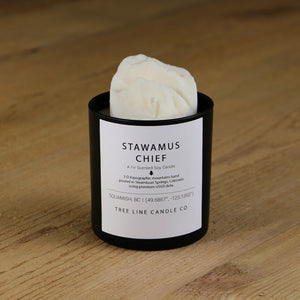  A white soy wax replica candle of Stawamus Chief in a round, black glass.